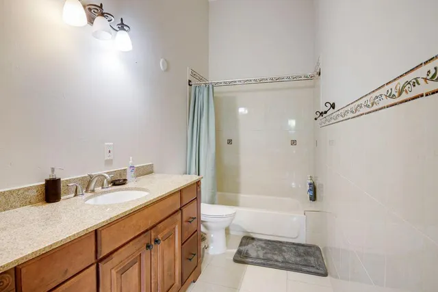 a bathroom with a sink double vanity and a bathtub