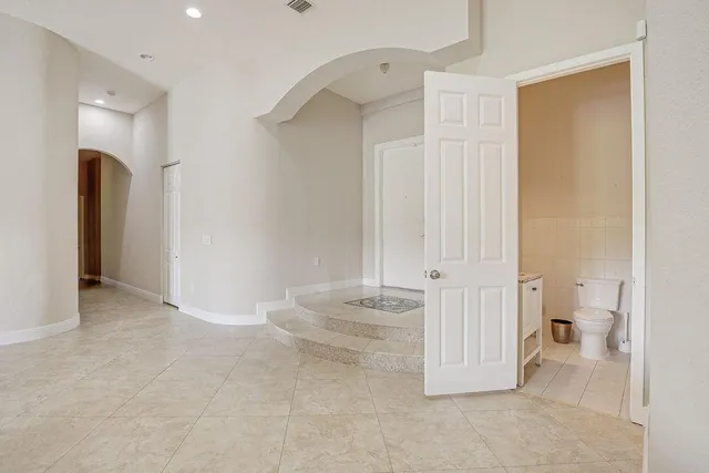 wooden floor and a bathroom with a sink