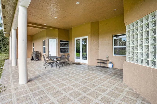 a view of a patio with a yard