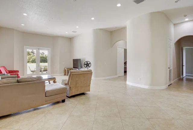 a living room with furniture and a window