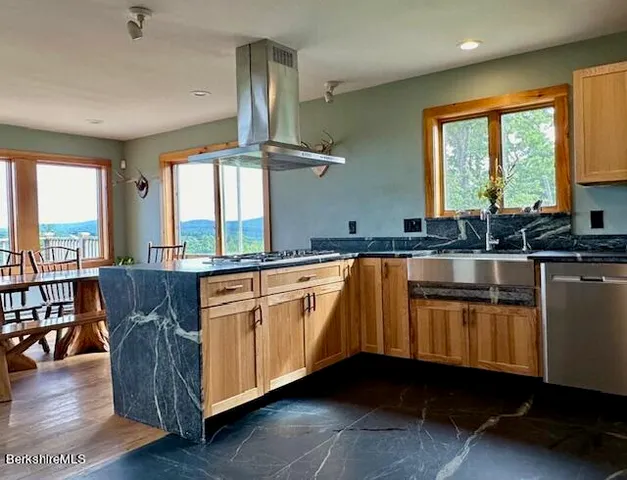 a living room with furniture ceiling fan and a window