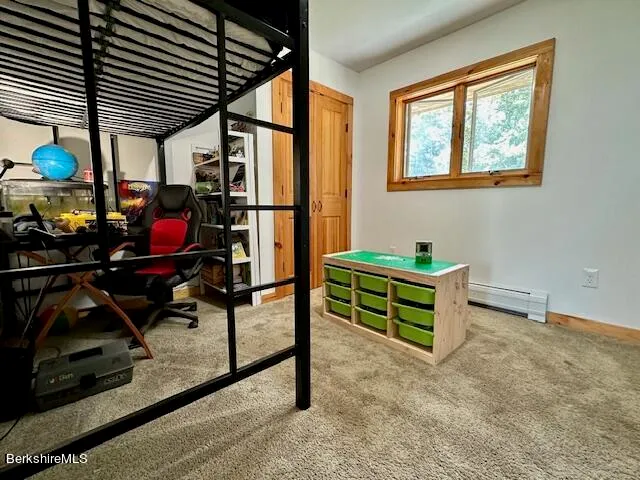 a view of an chairs and table in backyard