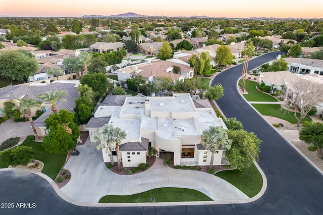 an aerial view of a house with yard swimming pool and outdoor seating