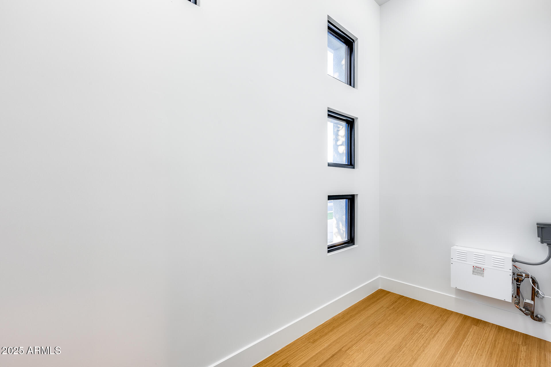 1101 East Warner Road, Unit 117 Tempe, AZ 85284 - Photo 28 of 69 a view of a room with wooden floor and cabinet