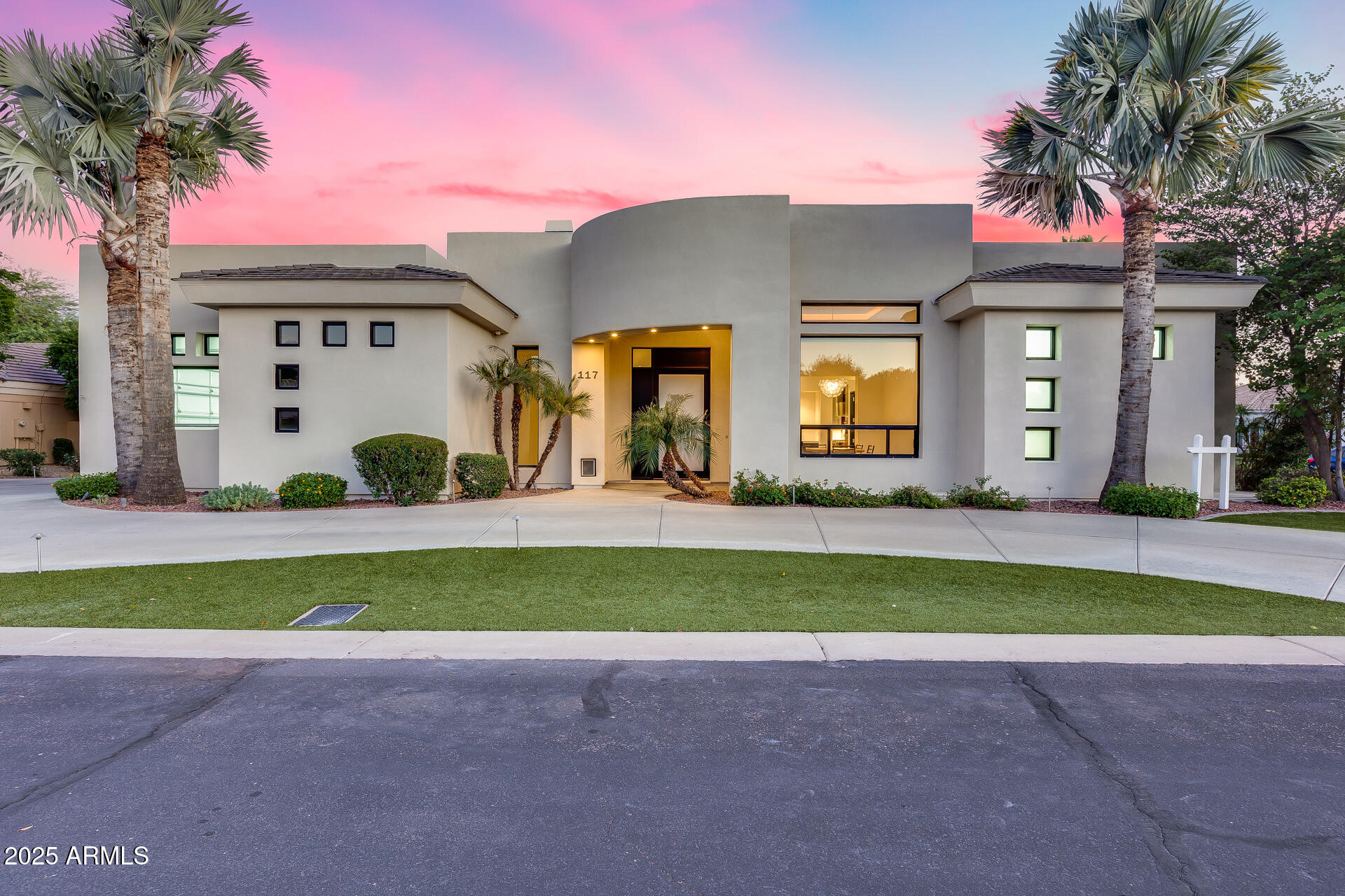 1101 East Warner Road, Unit 117 Tempe, AZ 85284 - Photo 3 of 69 a front view of a house with a garden and a tree