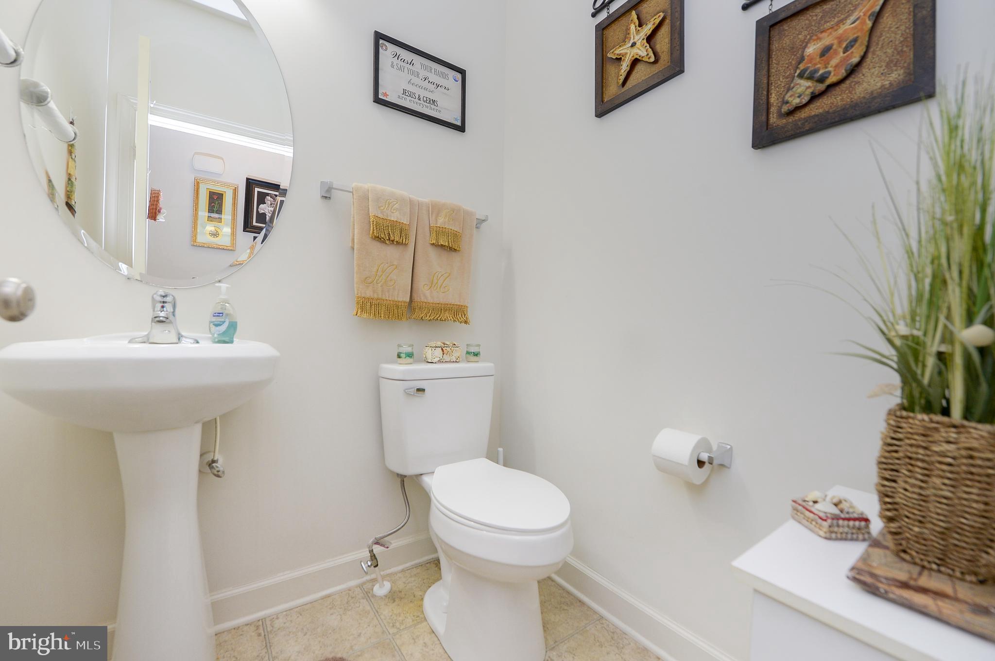 418 Bergenia Loop Bear, DE 19701 - Photo 13 of 27 a bathroom with a toilet a sink and a mirror