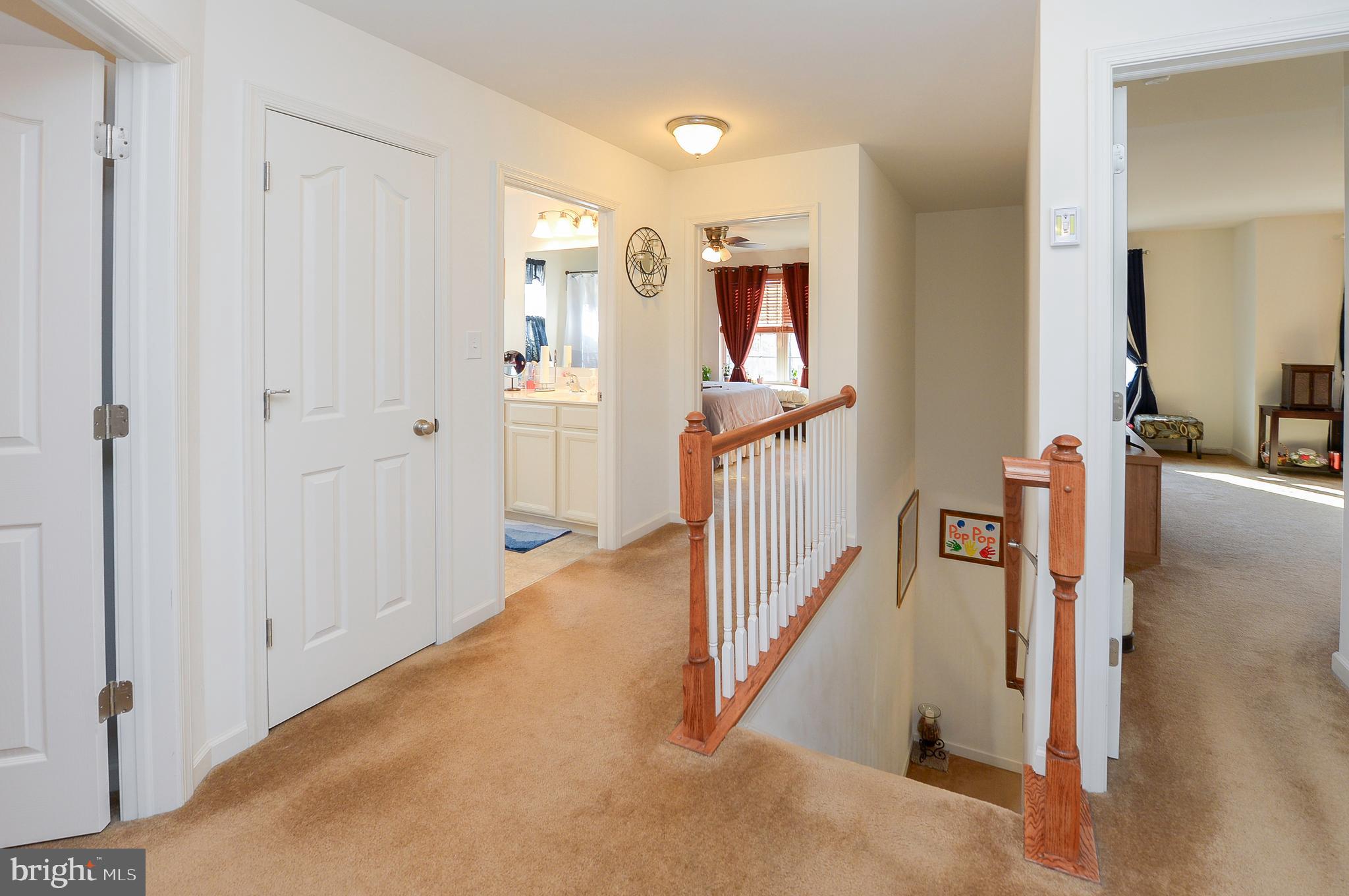 418 Bergenia Loop Bear, DE 19701 - Photo 15 of 27 a view of a livingroom with stairs and furniture
