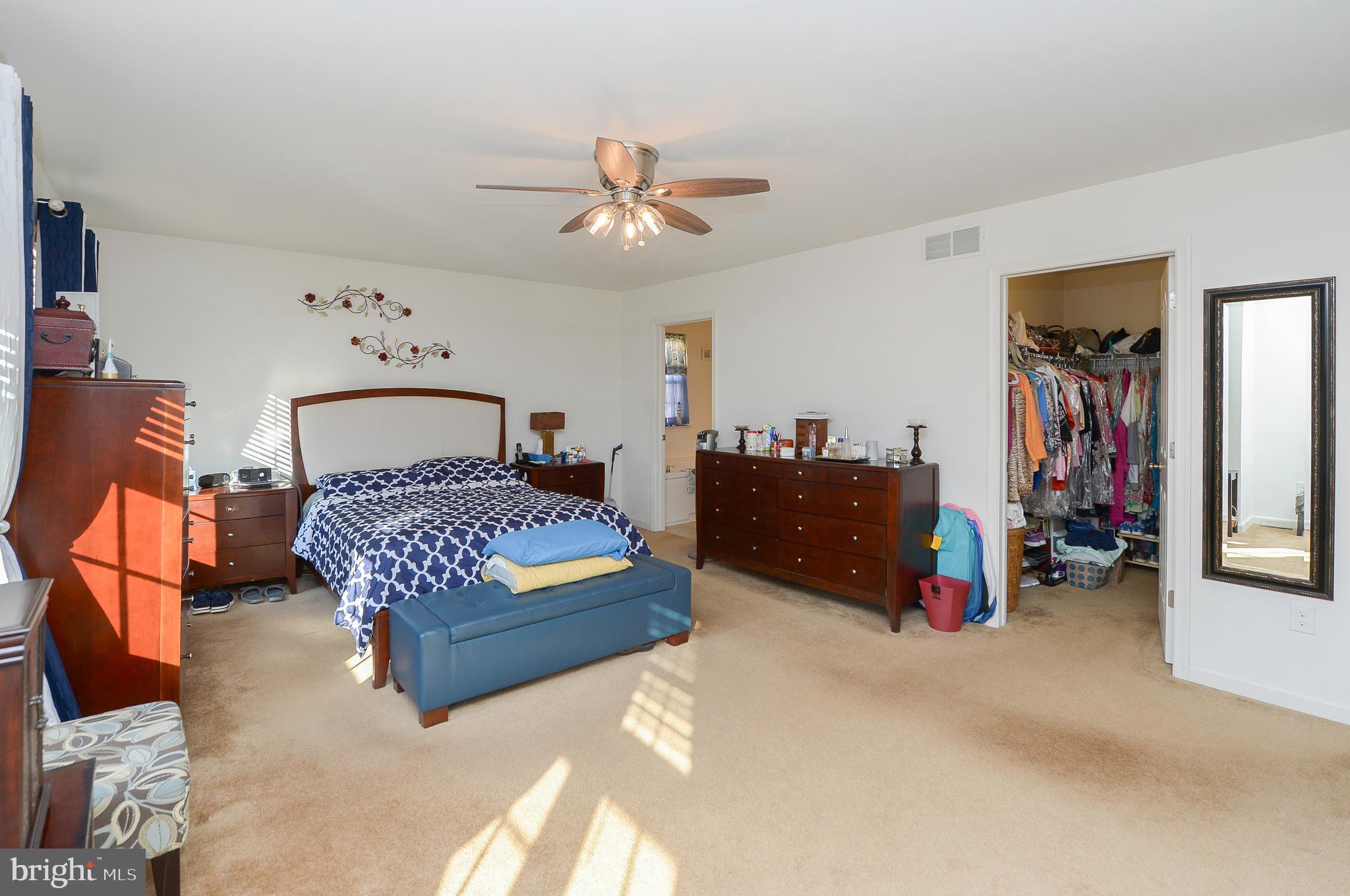 418 Bergenia Loop Bear, DE 19701 - Photo 17 of 27 a bedroom with a large bed and a chandelier