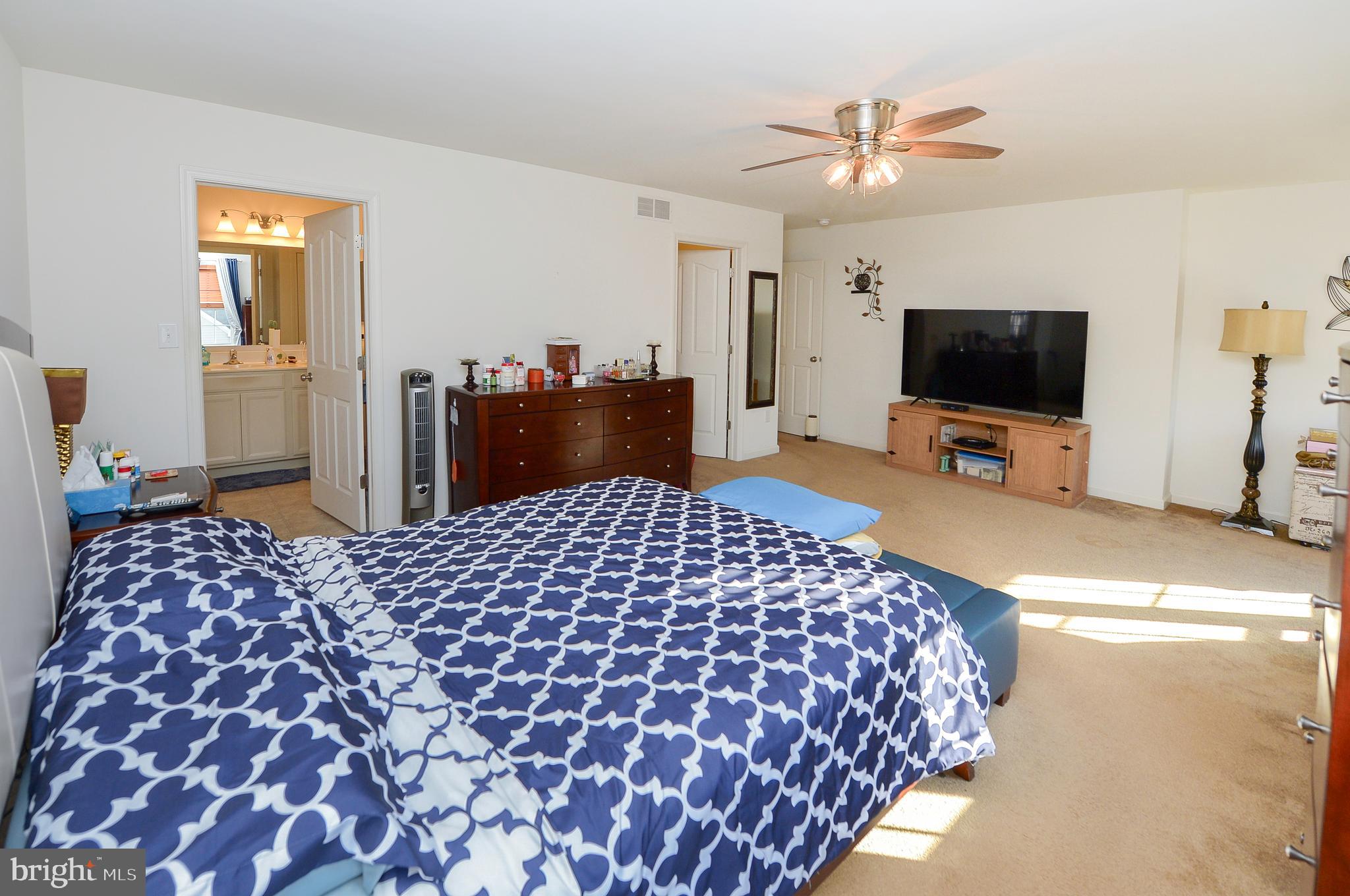 418 Bergenia Loop Bear, DE 19701 - Photo 18 of 27 a bedroom with a bed and a flat screen tv