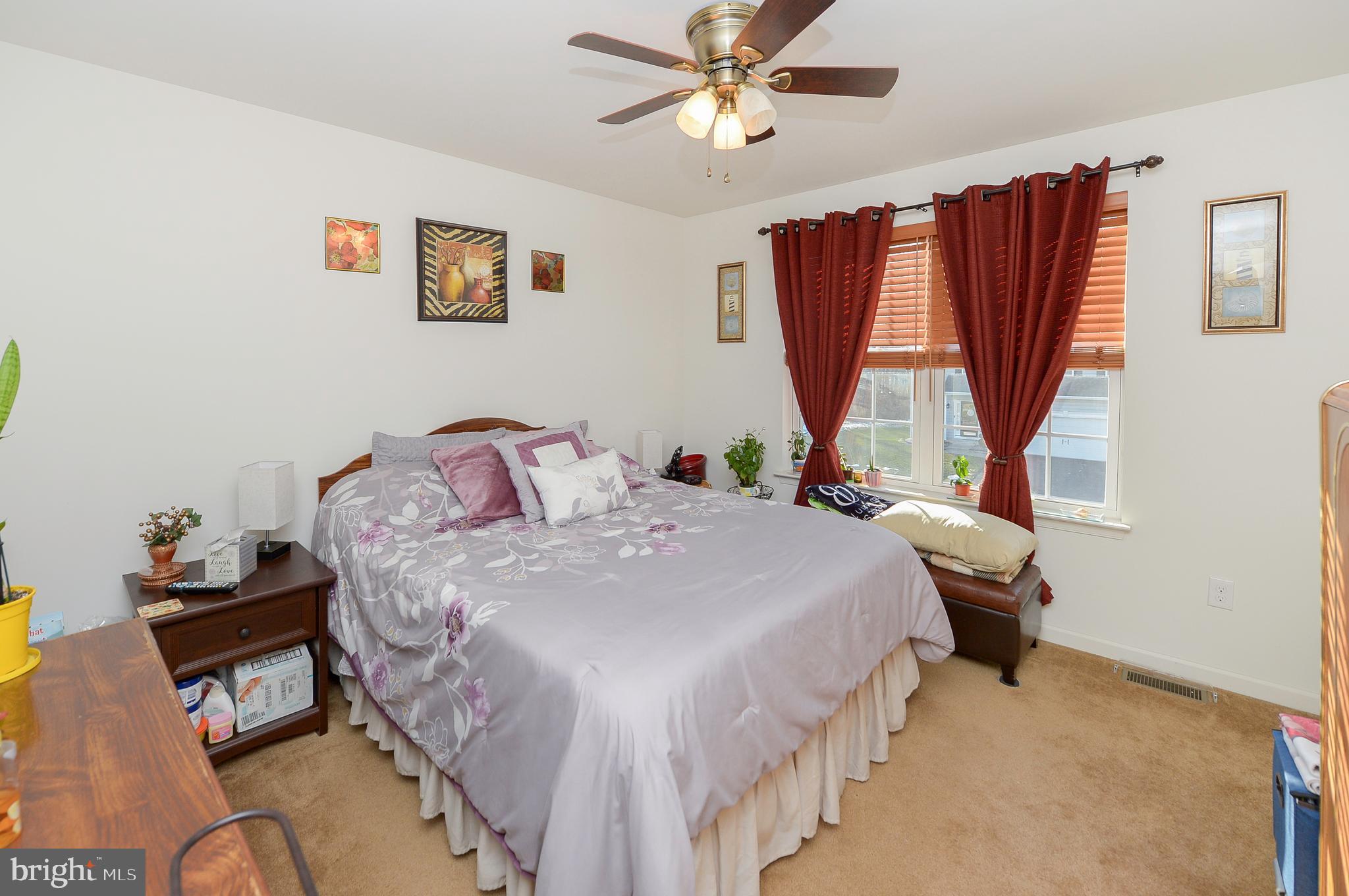 418 Bergenia Loop Bear, DE 19701 - Photo 21 of 27 a bedroom with a bed a window and dresser