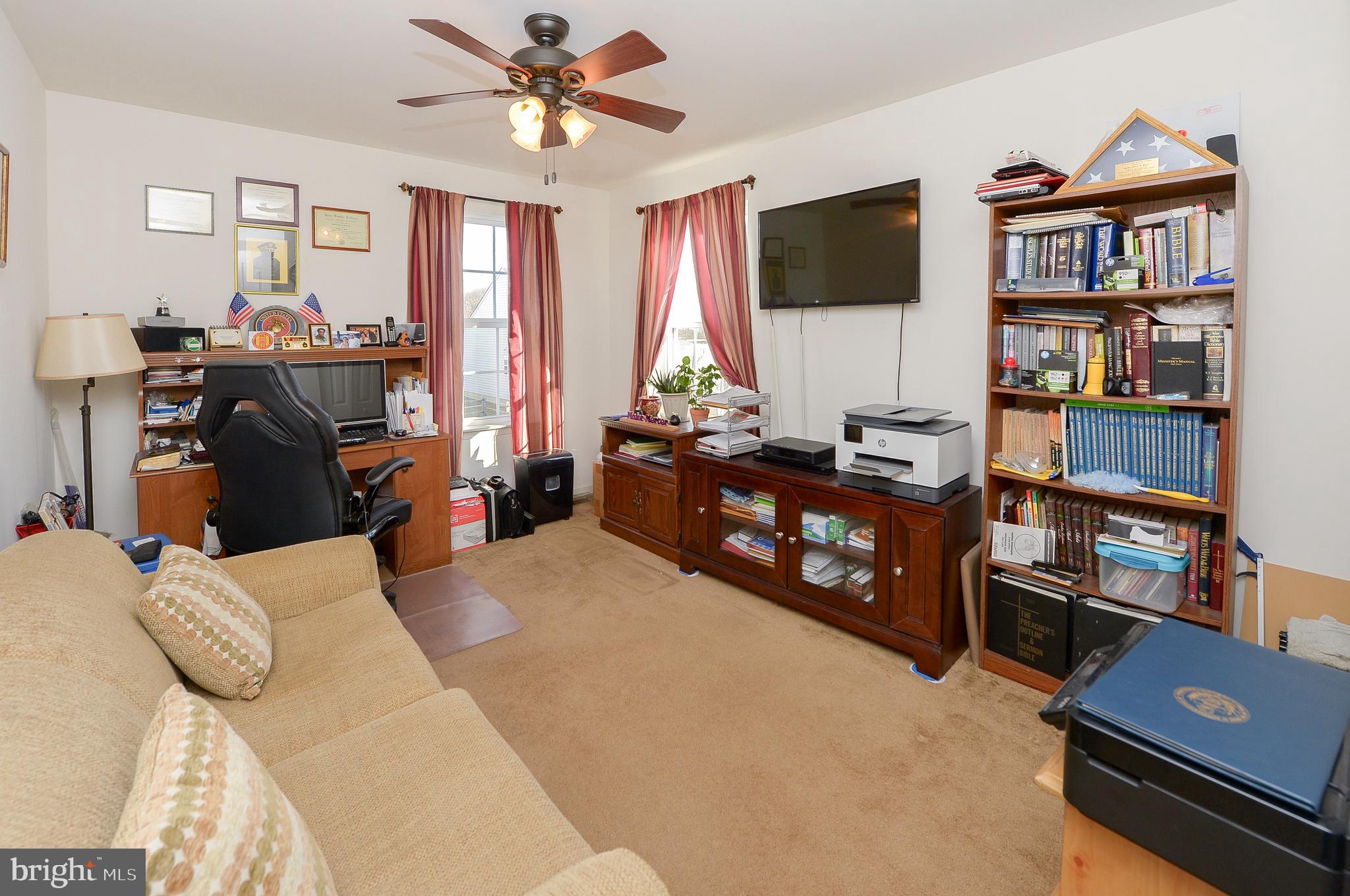 418 Bergenia Loop Bear, DE 19701 - Photo 22 of 27 a bedroom with furniture and a flat screen tv