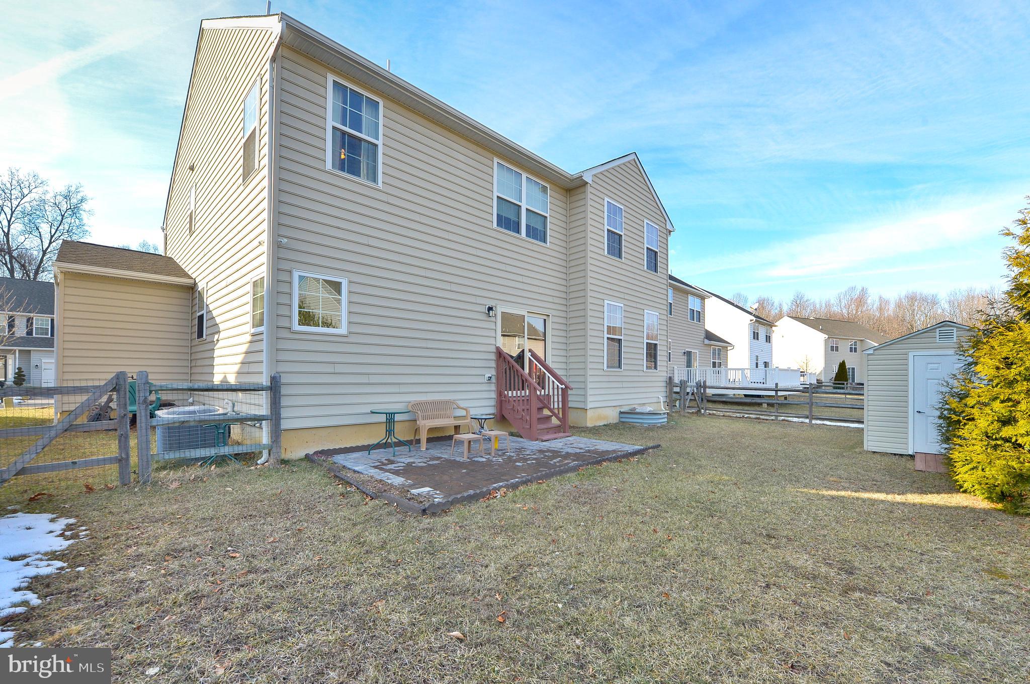418 Bergenia Loop Bear, DE 19701 - Photo 26 of 27 a backyard of a house with table and chairs