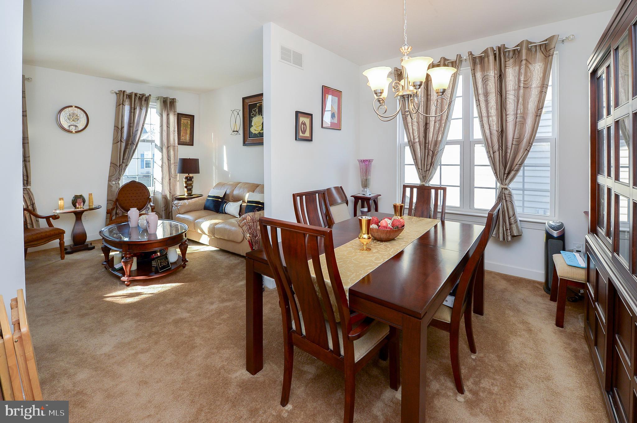 418 Bergenia Loop Bear, DE 19701 - Photo 5 of 27 a outdoor dining room with furniture and a large window