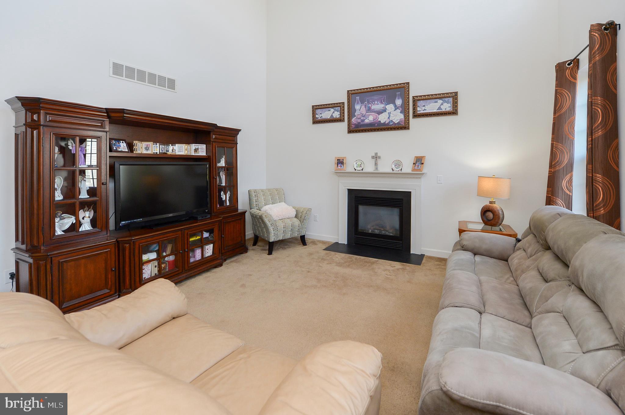 418 Bergenia Loop Bear, DE 19701 - Photo 6 of 27 a living room with furniture and a flat screen tv