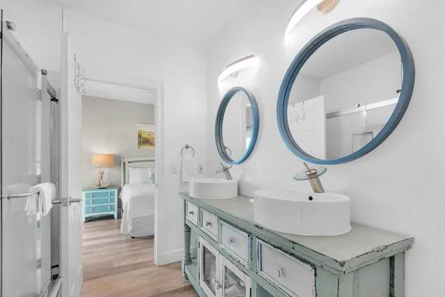 a bathroom with a glass shower door