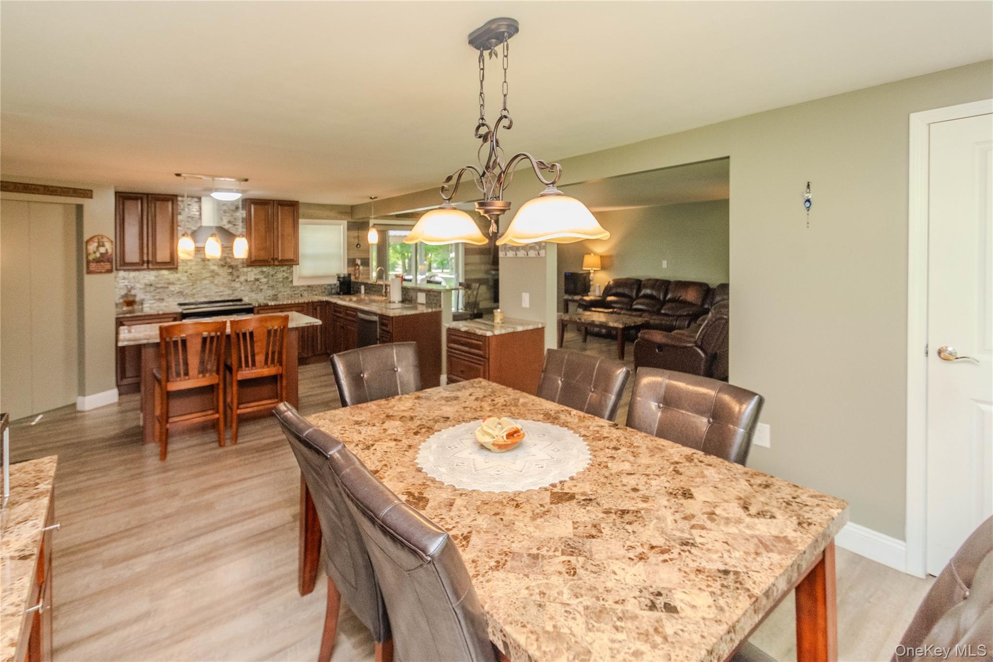 15 Van Dewark Road Middletown, NY 10941 - Photo 11 of 41 Dining area featuring wood-finish flooring and a decorative chandelier