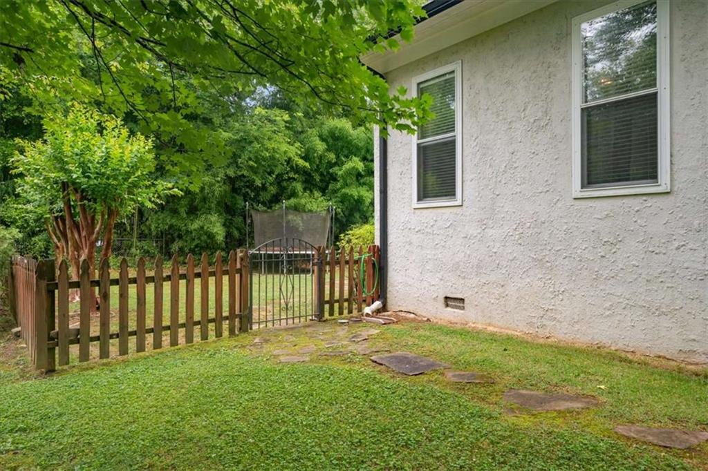106 Westmore Road Southwest Rome, GA 30165 - Photo 45 of 56 a view of a house with a backyard