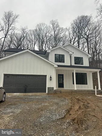 a front view of a house with garage