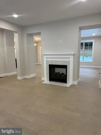 a view of empty room with a fireplace