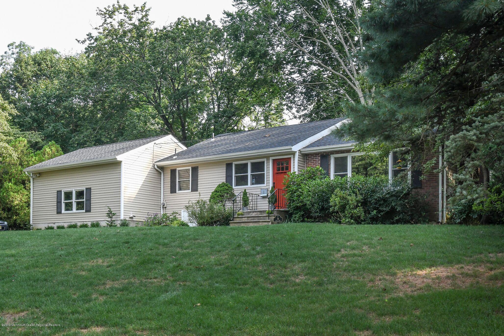 76 Bruce Road Red Bank, NJ 07701 - Photo 1 of 24 a view of a house with a yard and potted plants