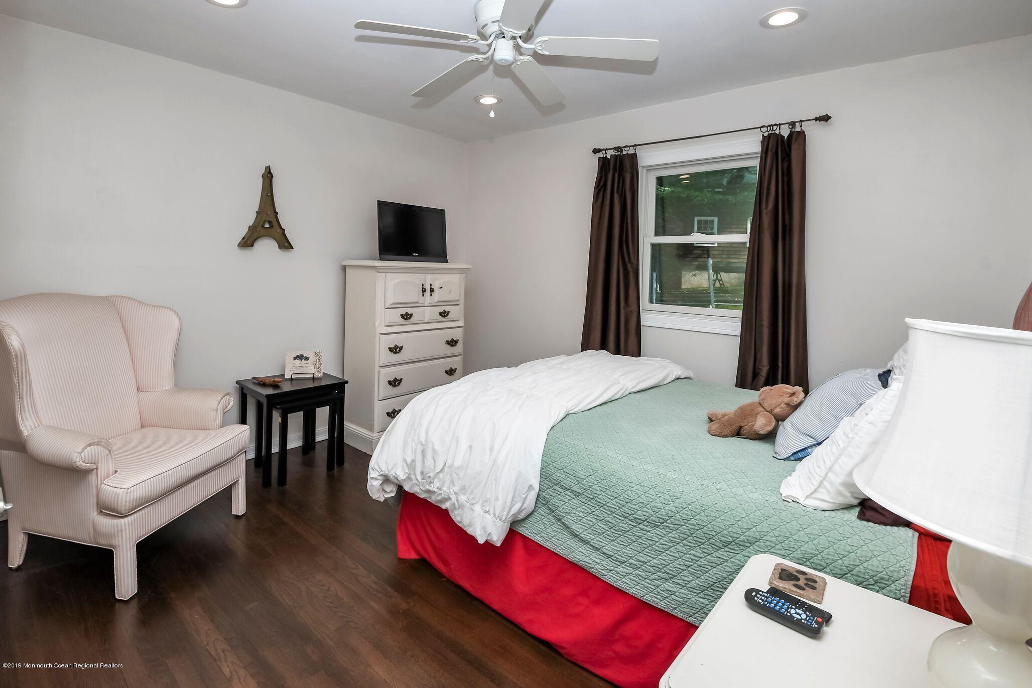 76 Bruce Road Red Bank, NJ 07701 - Photo 18 of 24 a bedroom with a bed and a couch