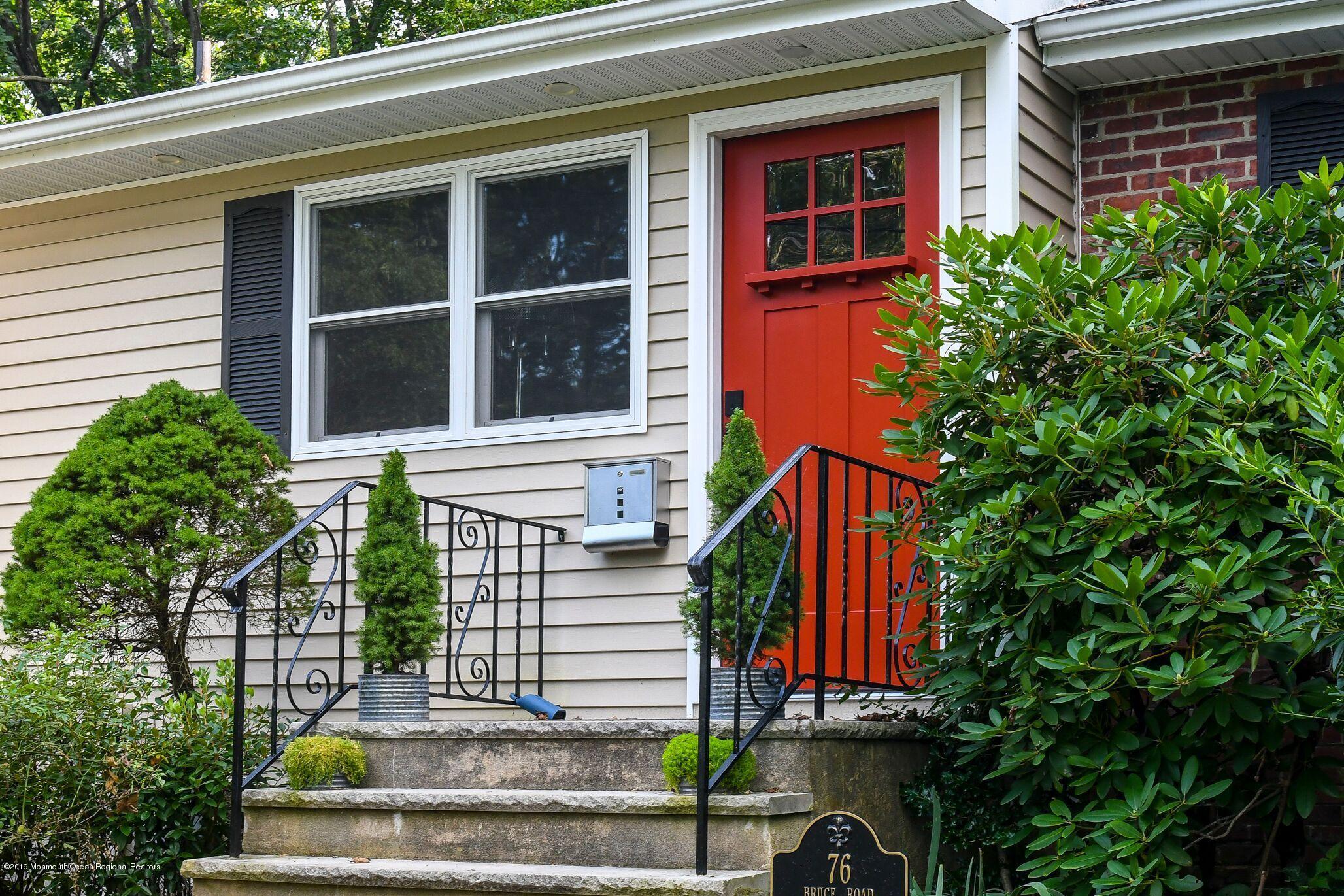 76 Bruce Road Red Bank, NJ 07701 - Photo 3 of 24 a front view of a house with a yard