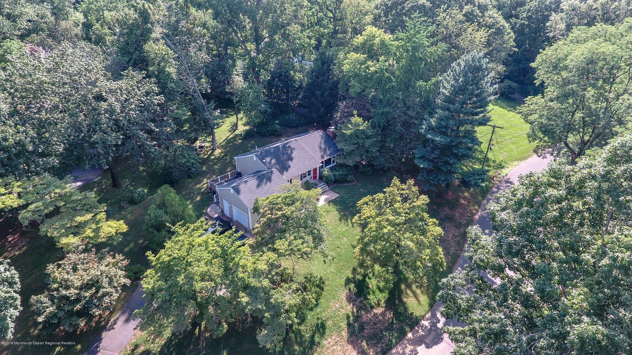 76 Bruce Road Red Bank, NJ 07701 - Photo 22 of 24 an aerial view of a house with a yard