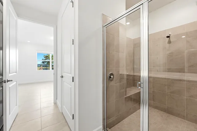 a bathroom with a shower and a sink