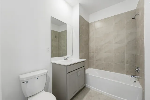 a bathroom with a toilet sink and bathtub