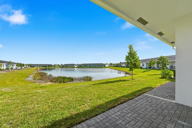 a view of a lake with houses in the background