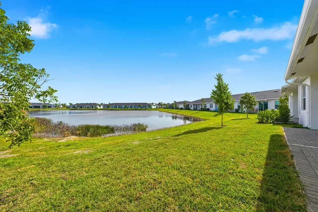 a view of an house with backyard space and garden