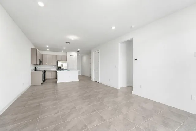 a view of a kitchen with a sink and cabinets