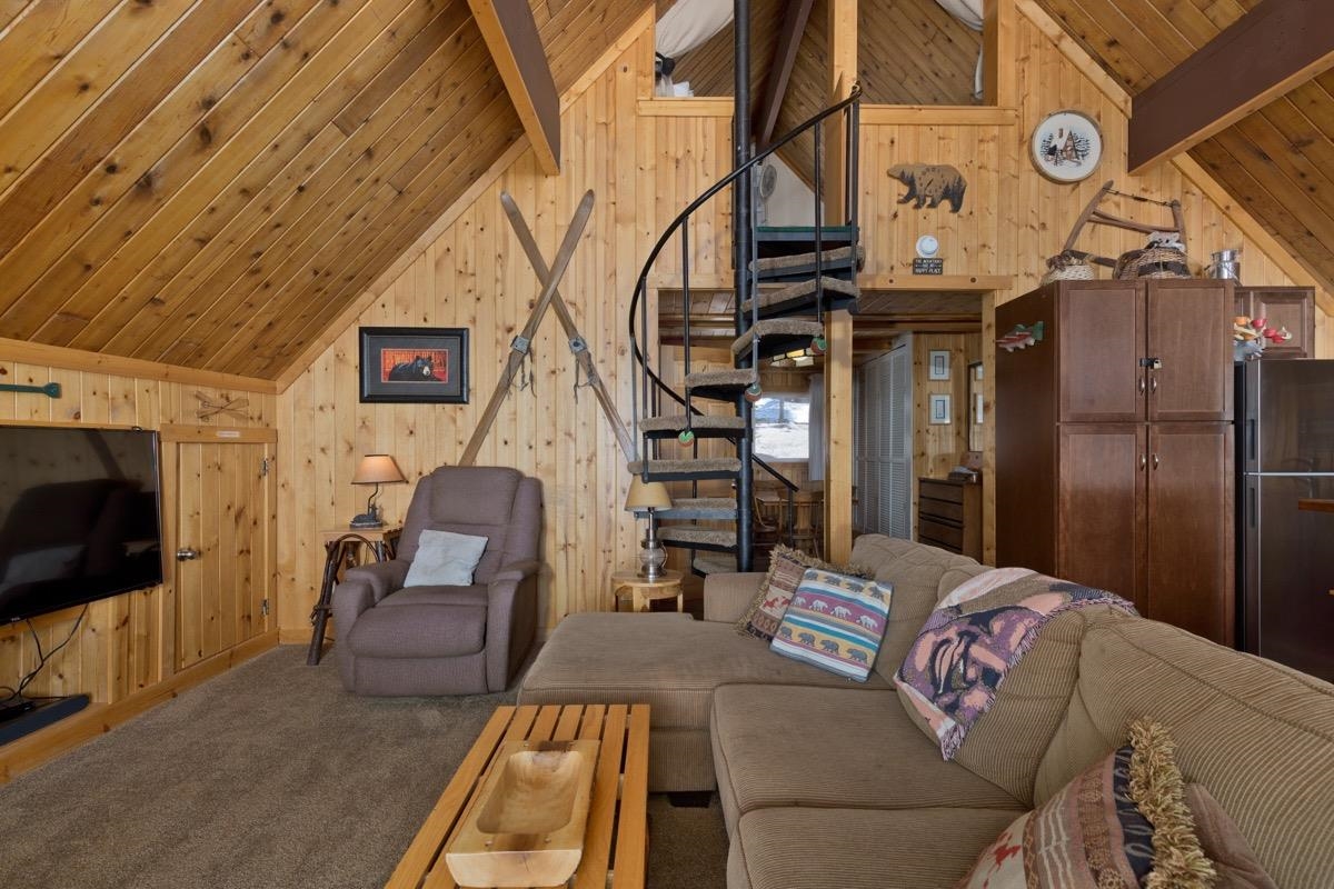 11000 Minaret Road, Unit 2 Mammoth Lakes, CA 93546 - Photo 12 of 31 a living room with furniture and a flat screen tv