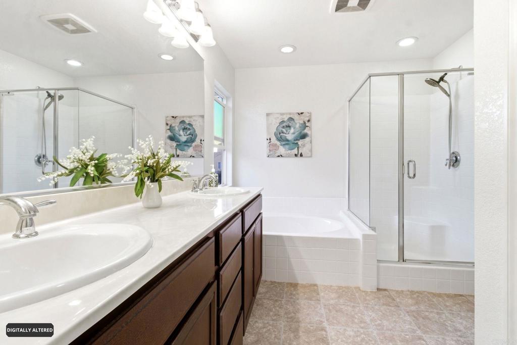 1508 Carpinteria Street Chula Vista, CA 91913 - Photo 16 of 39 a bathroom with a sink a shower and a mirror
