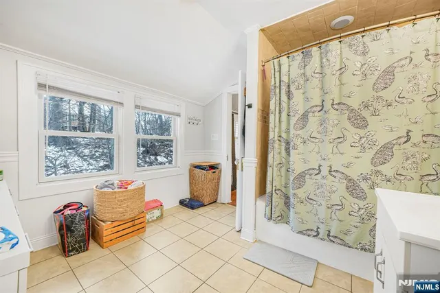 a view of balcony with wooden floor and outdoor seating