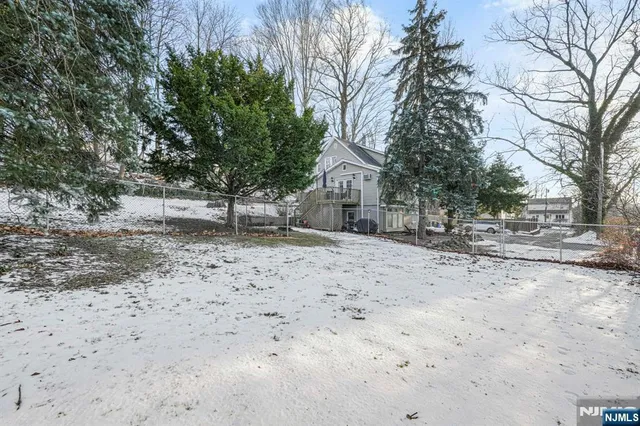 a view of a covered with snow in the yard