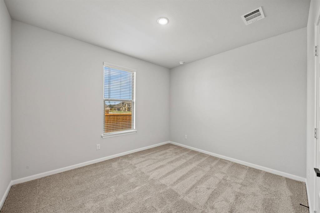 1422 Red Clover Avenue Van Alstyne, TX 75495 - Photo 21 of 30 an empty room with a window