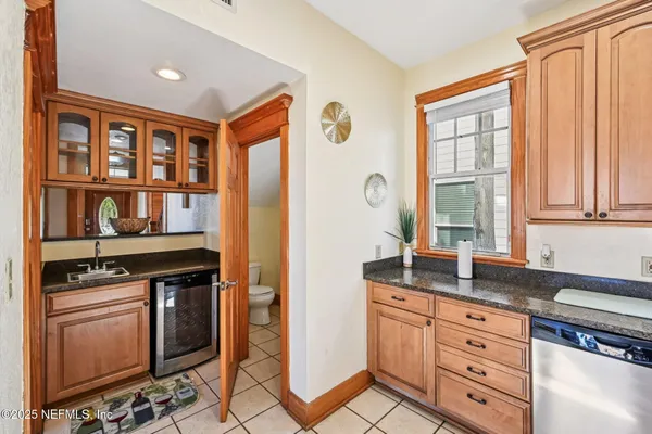 a kitchen with stainless steel appliances granite countertop a stove and a sink