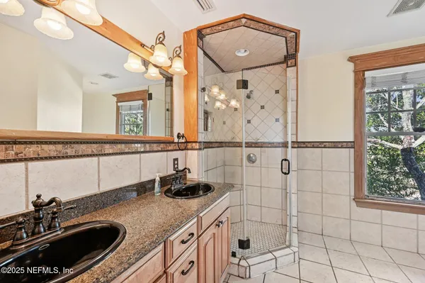 a bathroom with a sink a vanity and a mirror