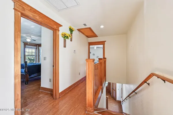 workspace with wooden floor and windows