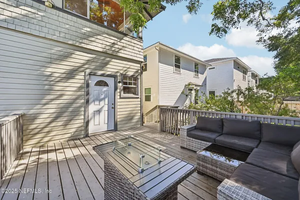 a view of a wooden chairs on the deck