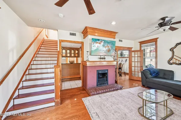 a living room with furniture and a fireplace