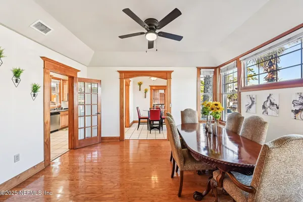 a dining room with furniture window wooden floor