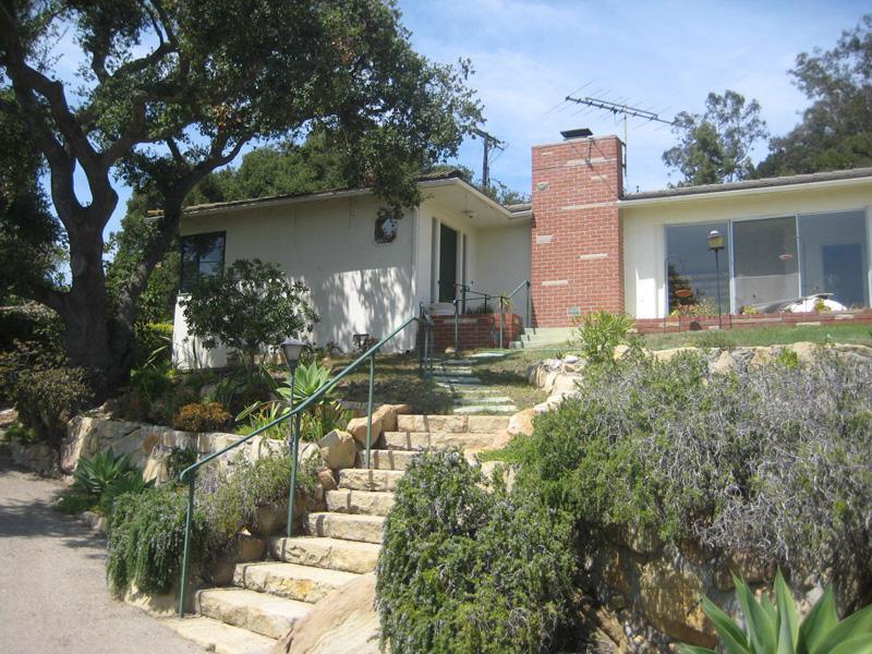 1602 Lasuen Road Santa Barbara, CA 93103 - Photo 1 of 5 a front view of house with yard and trees around
