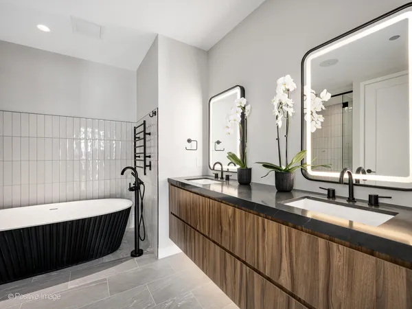 a bathroom with a bathtub and shower