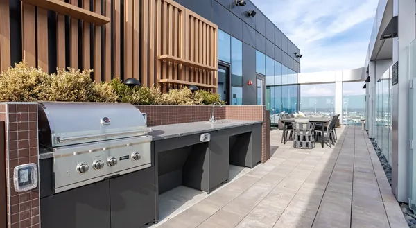 a living room with furniture and painting on the wall
