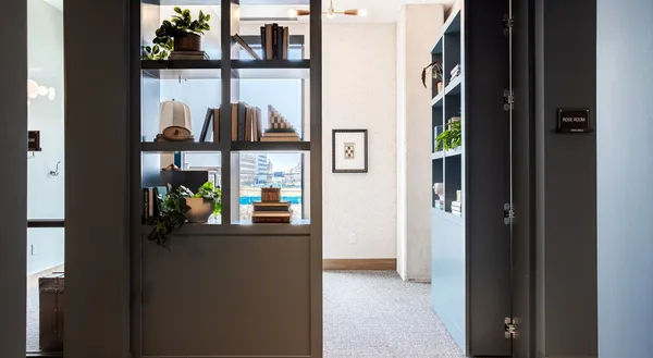 a kitchen with a sink a table and chairs