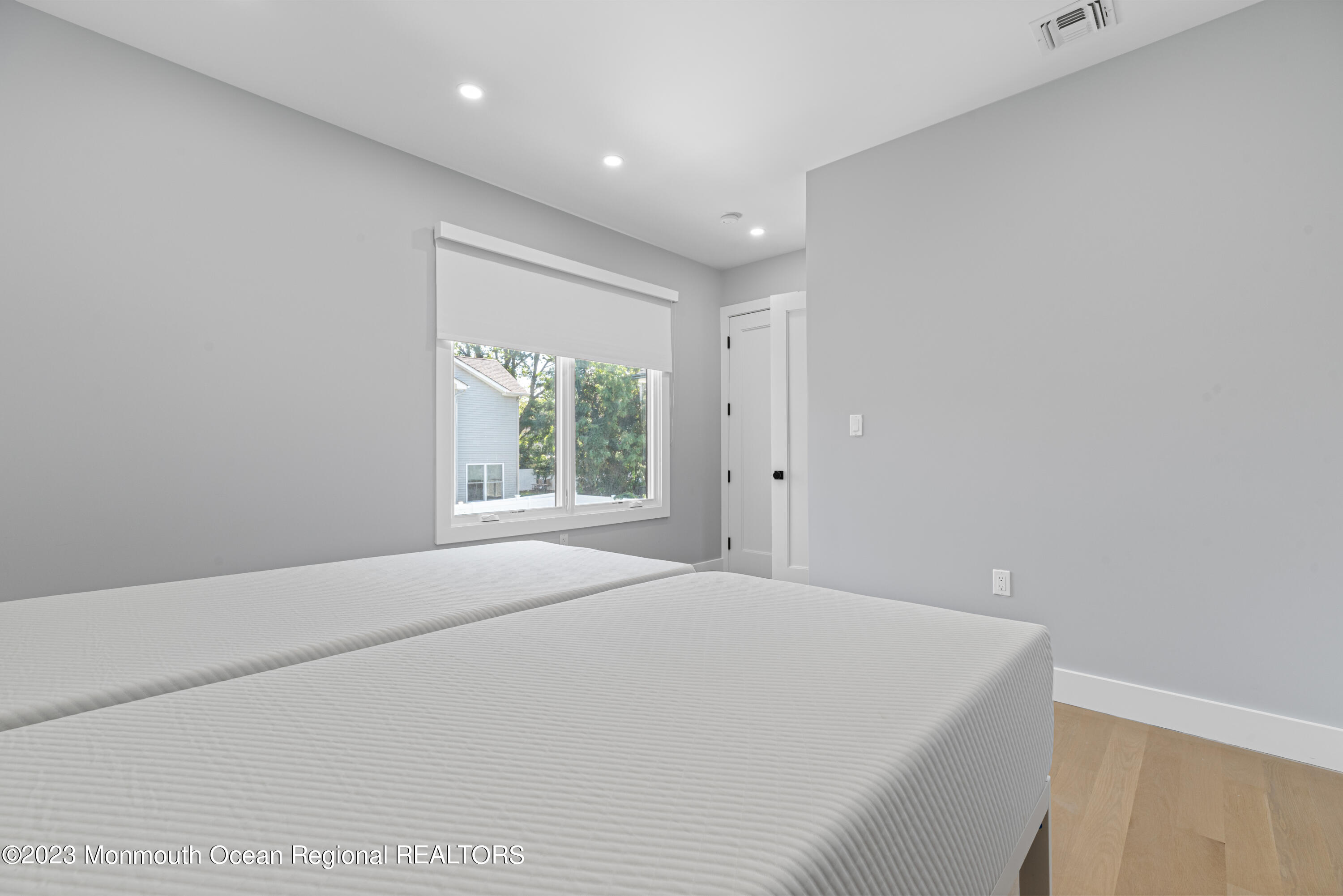 929 Van Ct Avenue Long Branch, NJ 07740 - Photo 21 of 37 a large white bed in a room next to a window