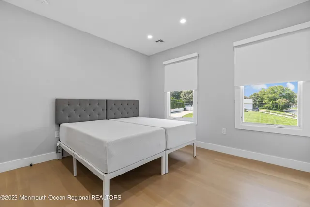 a room with a bed and window