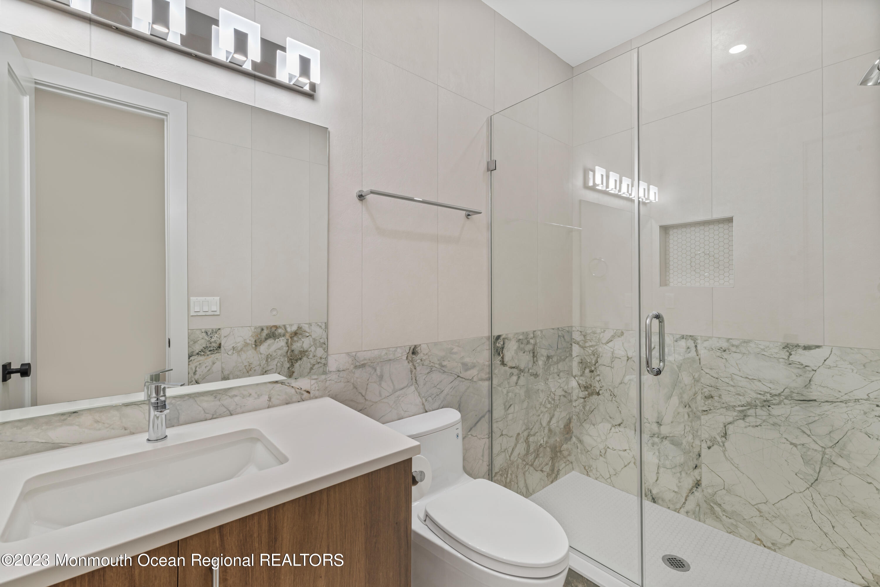 929 Van Ct Avenue Long Branch, NJ 07740 - Photo 26 of 37 a bathroom with a sink a toilet and shower